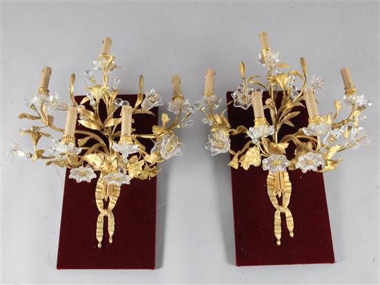 A pair of Napoleon III ormolu and Baccarat glass five branch wall lights, height overall 29in. width 21in.